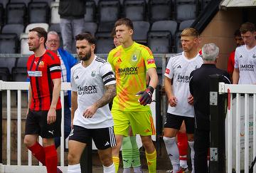 Michael Potts leads Bamber Bridge out in pre-season against Wythenshawe