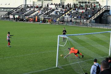Corey Parchment's penalty is saved by Ben Goode.