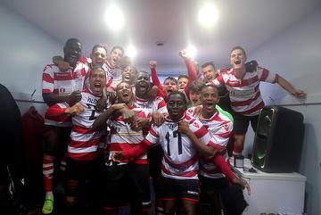 Kingstonian celebrating after the win at Macclesfield